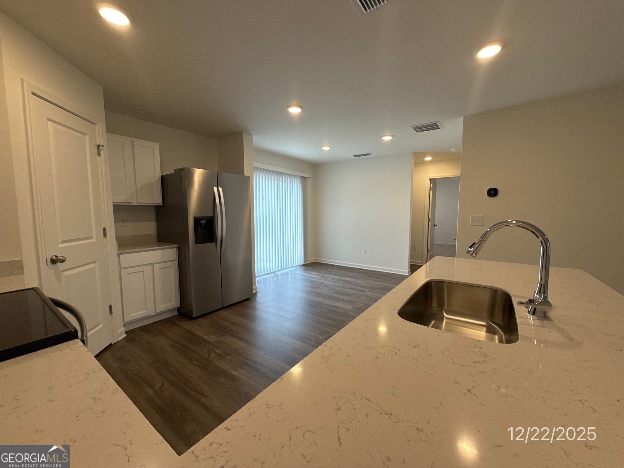 489 Grand Magnolia Street Jackson, GA 30233 - Photo 3 of 19 a view of a livingroom with wooden floor