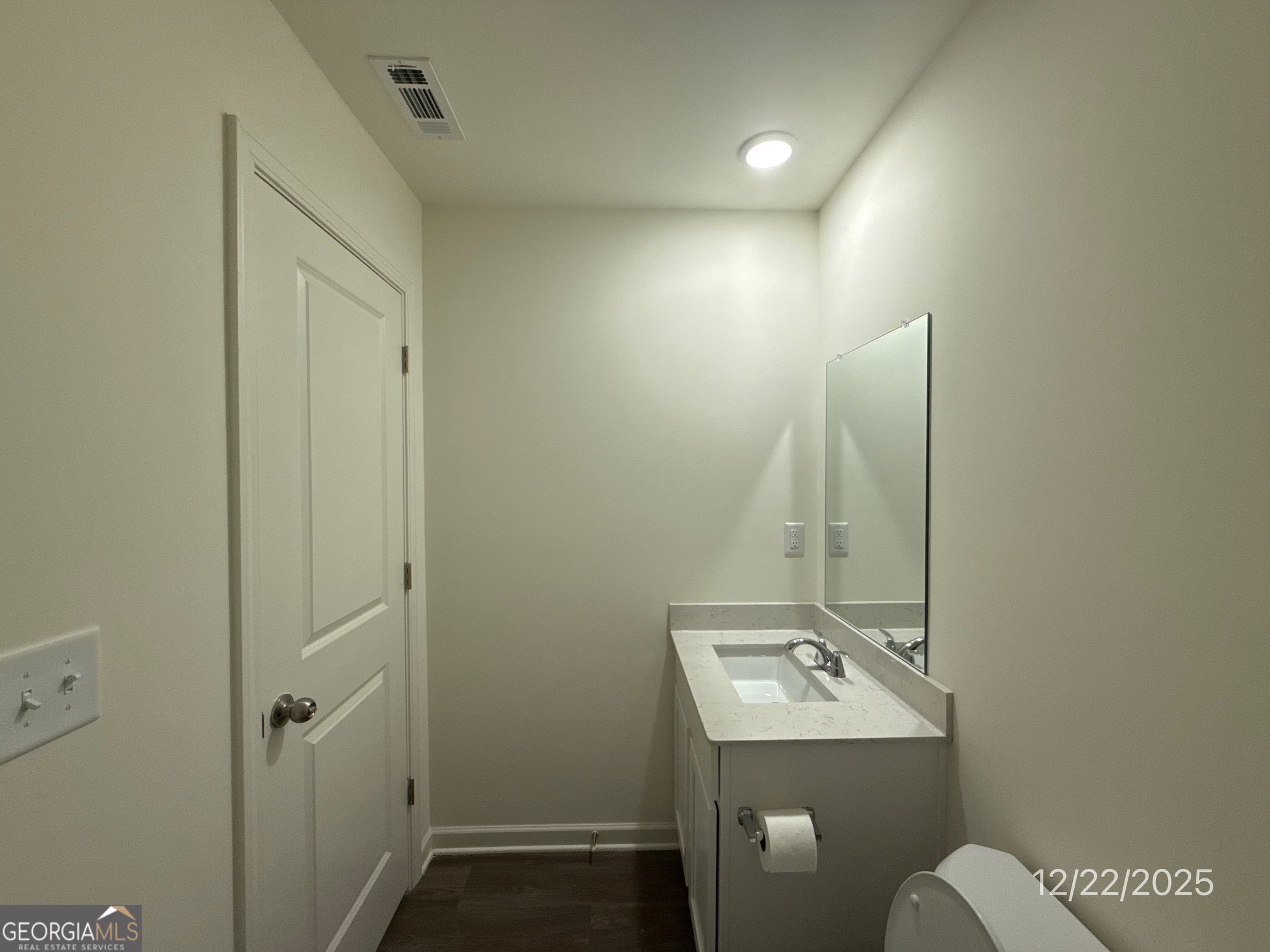 489 Grand Magnolia Street Jackson, GA 30233 - Photo 9 of 19 a bathroom with a sink a toilet and mirror