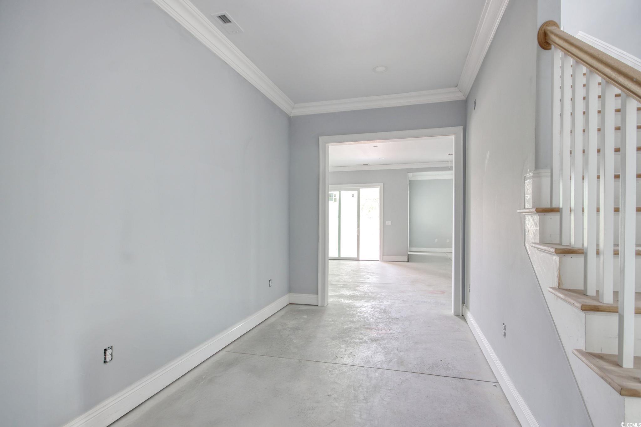 105 Michau Road Georgetown, SC 29440 - Photo 9 of 32 Hall with stairs, concrete flooring, ornamental mo