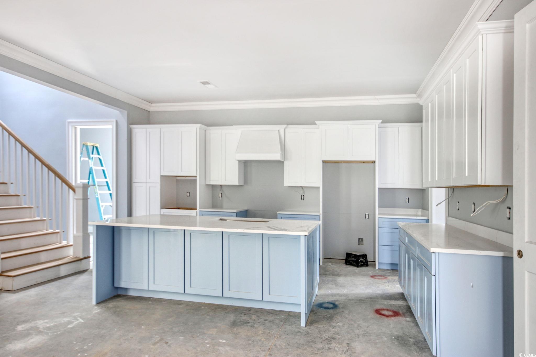 105 Michau Road Georgetown, SC 29440 - Photo 10 of 32 Kitchen with a kitchen island, crown molding, unfi