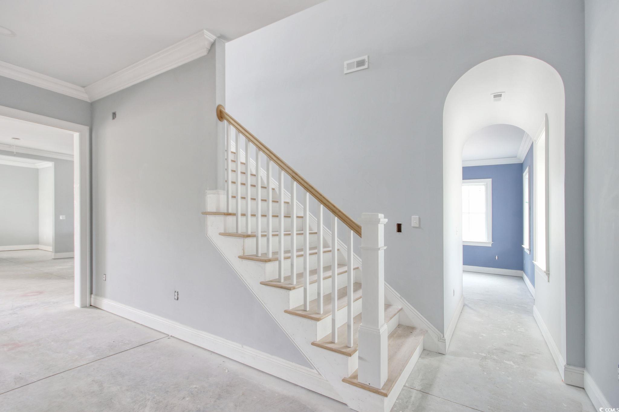 105 Michau Road Georgetown, SC 29440 - Photo 14 of 32 Staircase with unfinished concrete flooring, crown