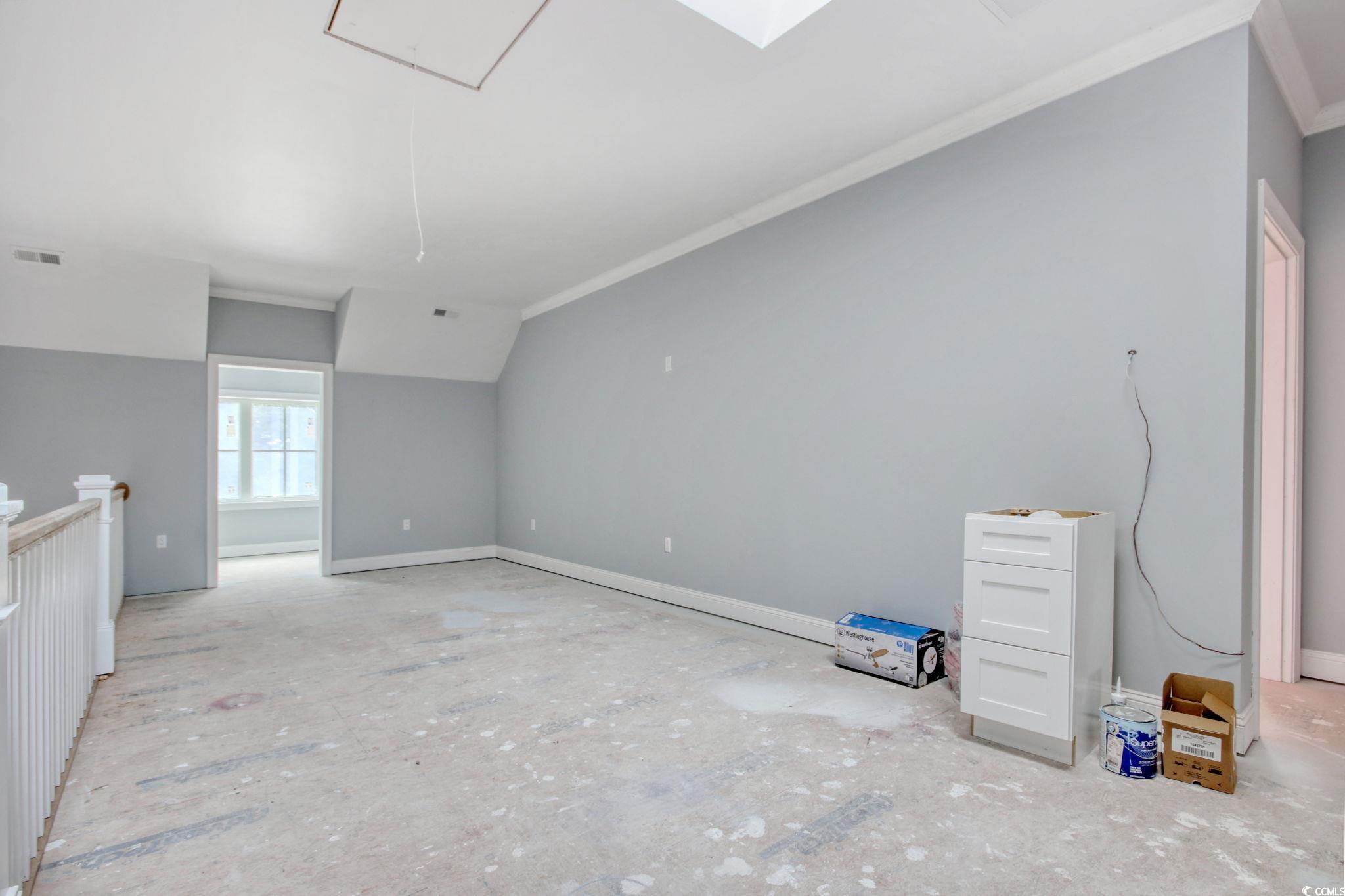 105 Michau Road Georgetown, SC 29440 - Photo 24 of 32 Spare room with attic access, crown molding, and b