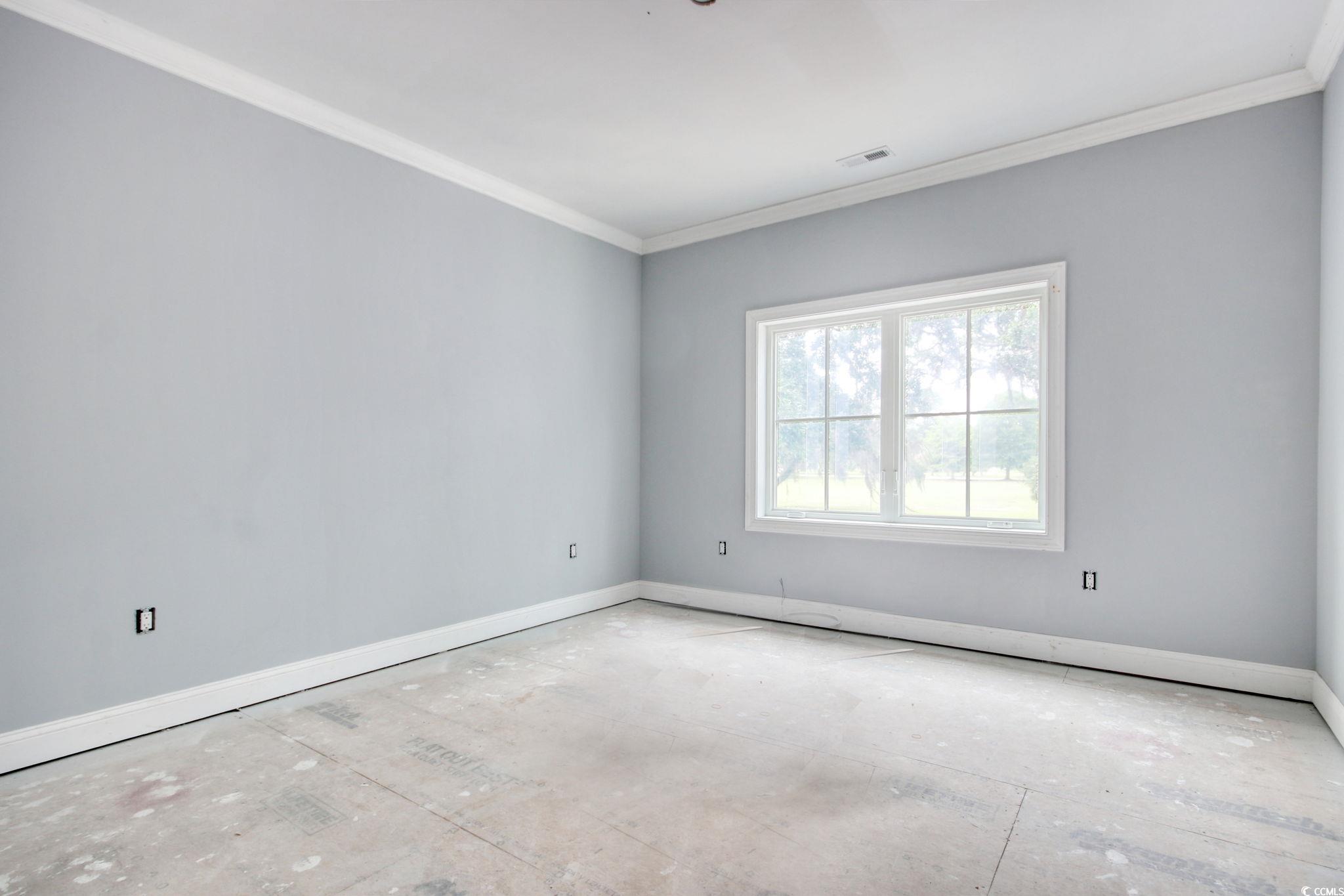 105 Michau Road Georgetown, SC 29440 - Photo 27 of 32 Empty room with crown molding and baseboards