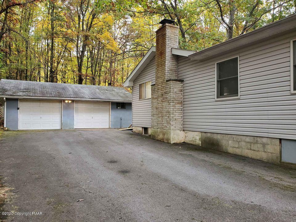 1615 Silver Maple Road Effort, PA 18330 - Photo 3 of 13 a backyard of a house with garage