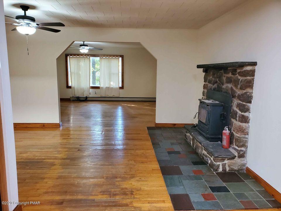 1615 Silver Maple Road Effort, PA 18330 - Photo 5 of 13 a view of livingroom with hardwood floor and a ceiling fan