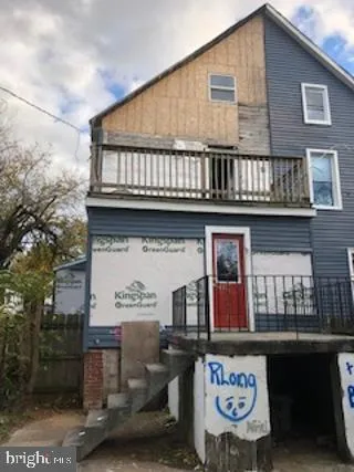 a front view of a building with retail shops