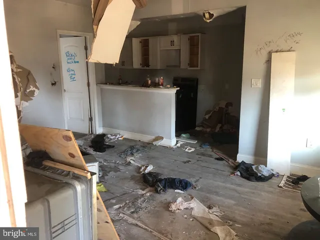 a living room with a couch and a fireplace