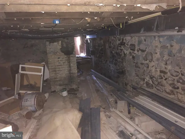 a view of a yard with wooden fence