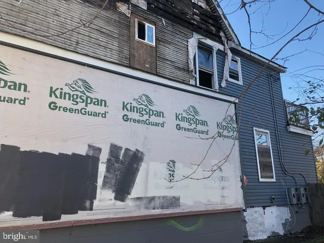 a front view of a building with retail shops