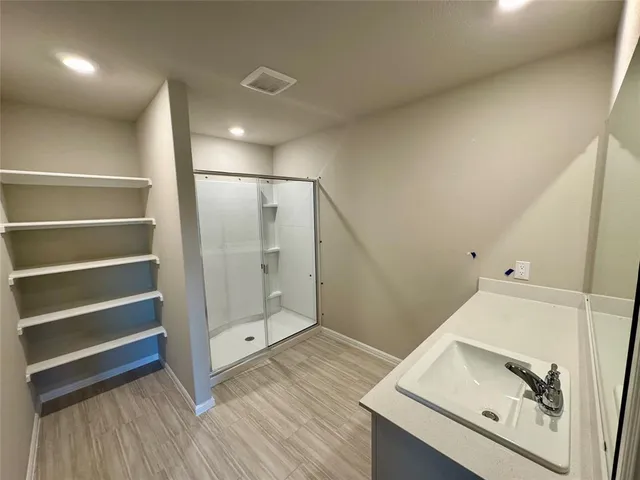 a view of an empty room with a window