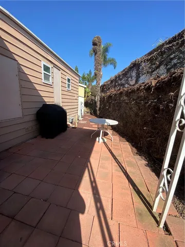 a backyard of a house with a tree