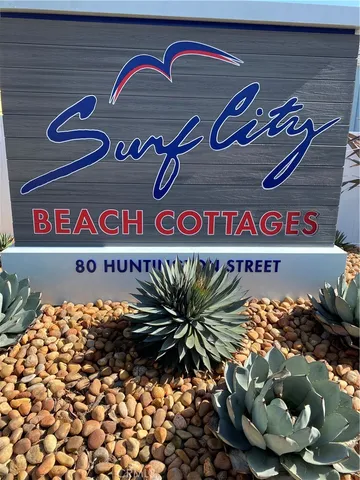 a street sign that is on a brick wall