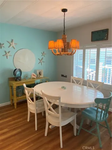 a dining room table chair and a chandelier