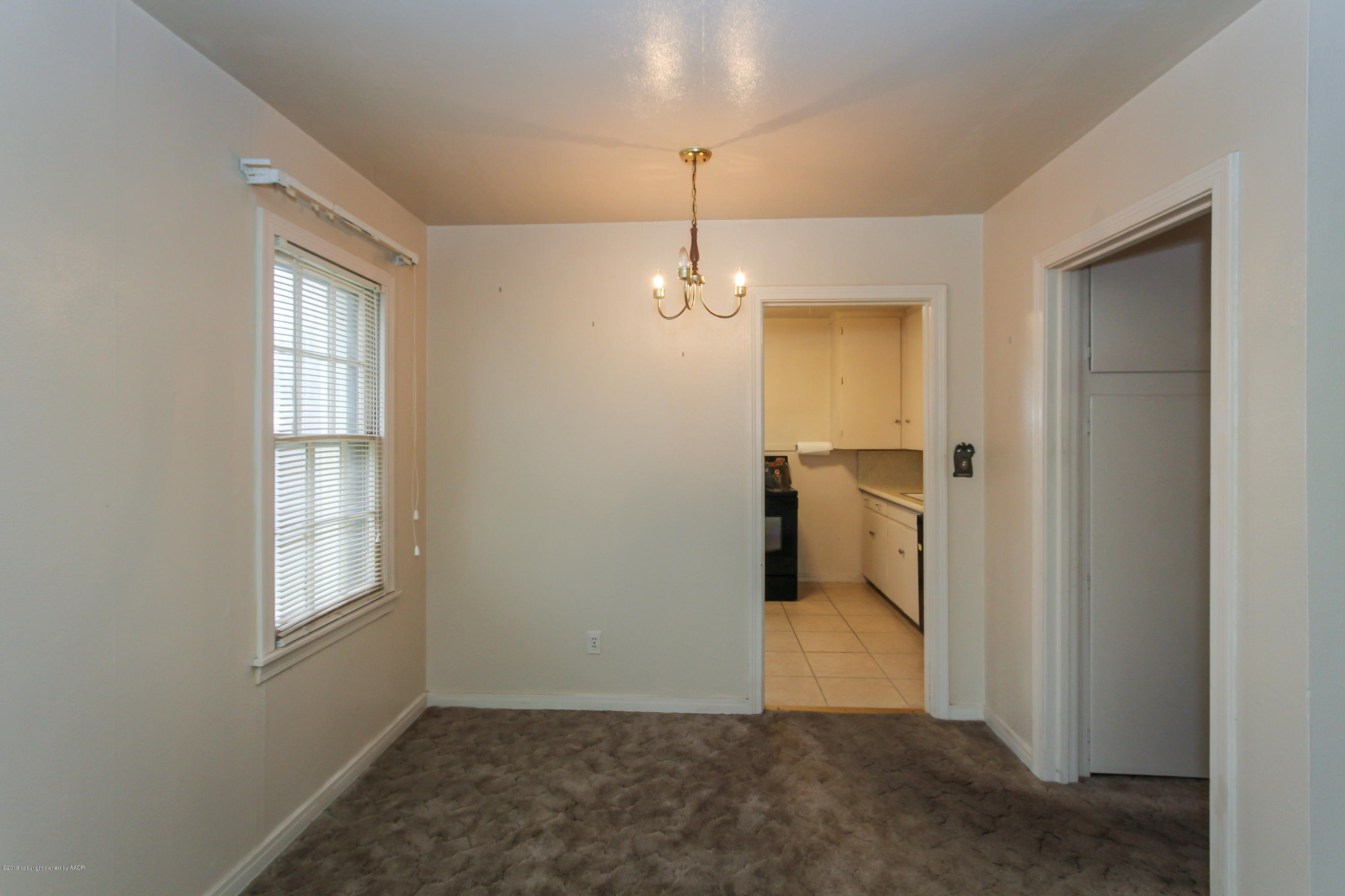 3609 South Lipscomb Street Amarillo, TX 79110 - Photo 13 of 28 a view of a room with a chandeliers