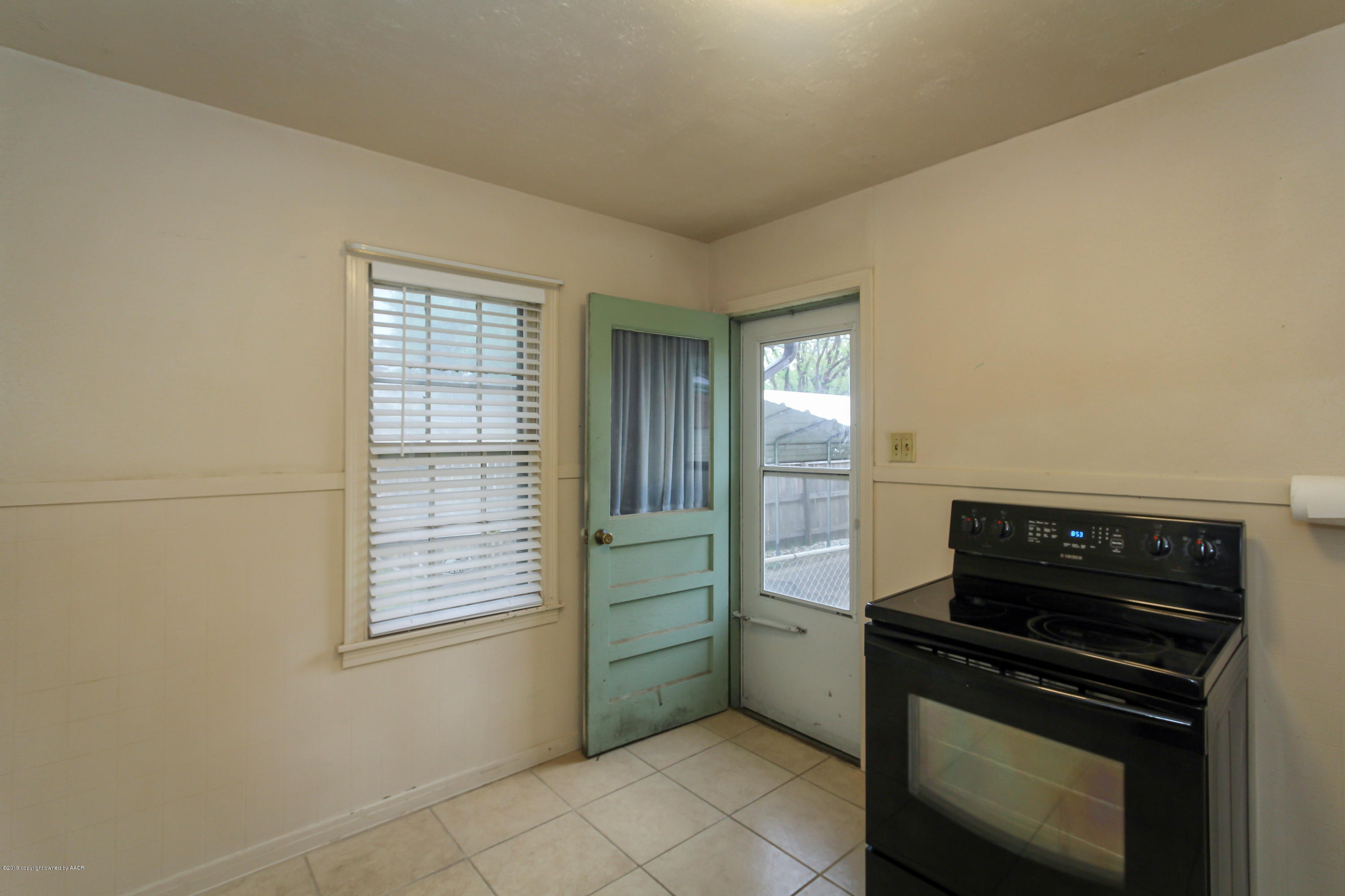 3609 South Lipscomb Street Amarillo, TX 79110 - Photo 10 of 28 a kitchen with a stove and a microwave