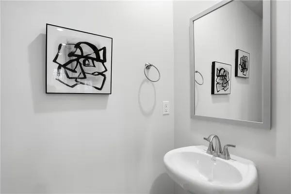 a bathroom with a sink and mirror