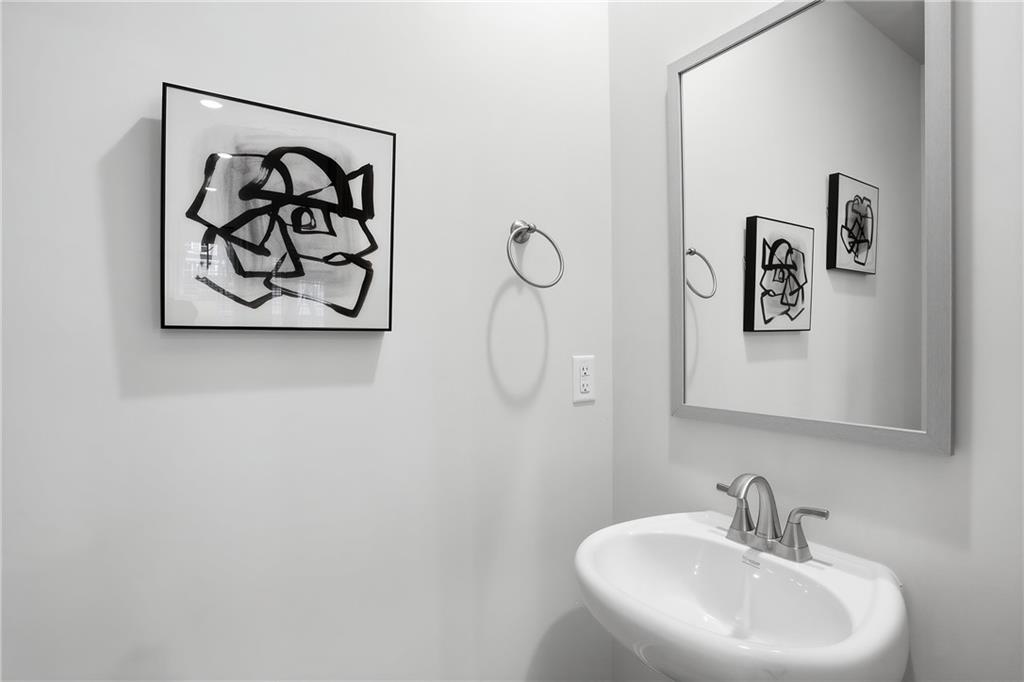 205 Harrell Way Fayetteville, GA 30215 - Photo 11 of 20 a bathroom with a sink and mirror