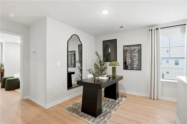 a dining room with furniture and window