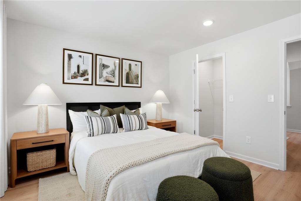 205 Harrell Way Fayetteville, GA 30215 - Photo 13 of 20 a bedroom with a bed and a lamp