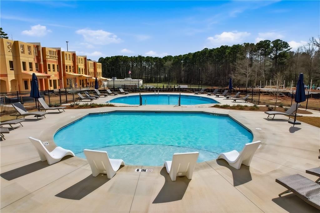 205 Harrell Way Fayetteville, GA 30215 - Photo 17 of 20 a view of a swimming pool and lounge chairs