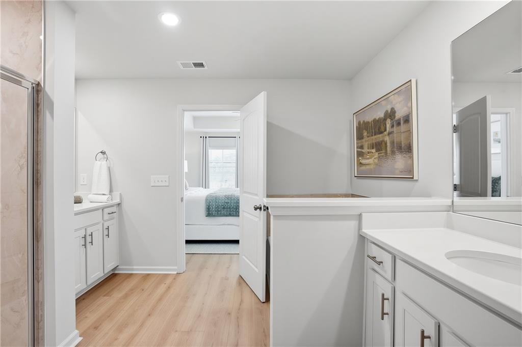 205 Harrell Way Fayetteville, GA 30215 - Photo 10 of 20 a spacious bathroom with a sink and a mirror
