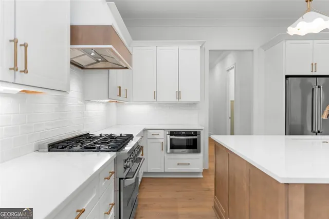 a spacious bathroom with a shower sink and mirror