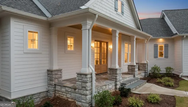a view of a porch with chairs and tables