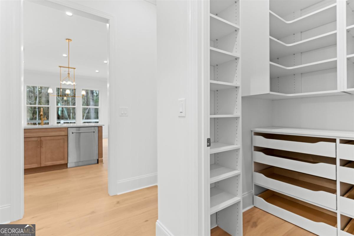 103 Mags Path Eatonton, GA 31024 - Photo 35 of 66 a view of walk in closet with empty racks