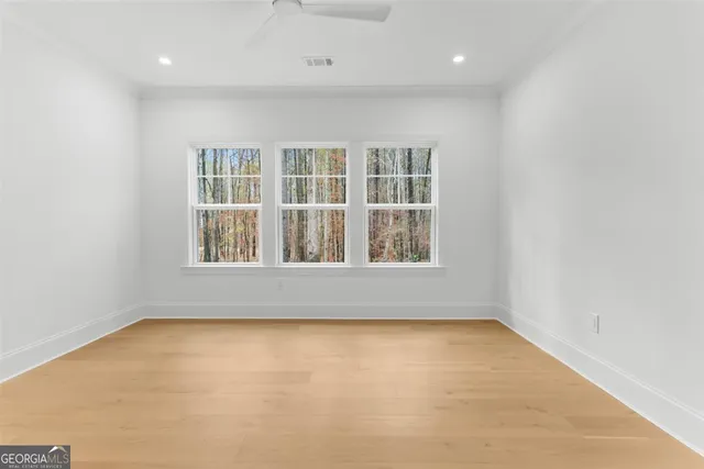 a view of a house with swimming pool and sitting area
