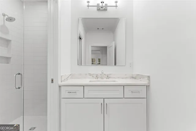 a view of a backyard with plants and a patio