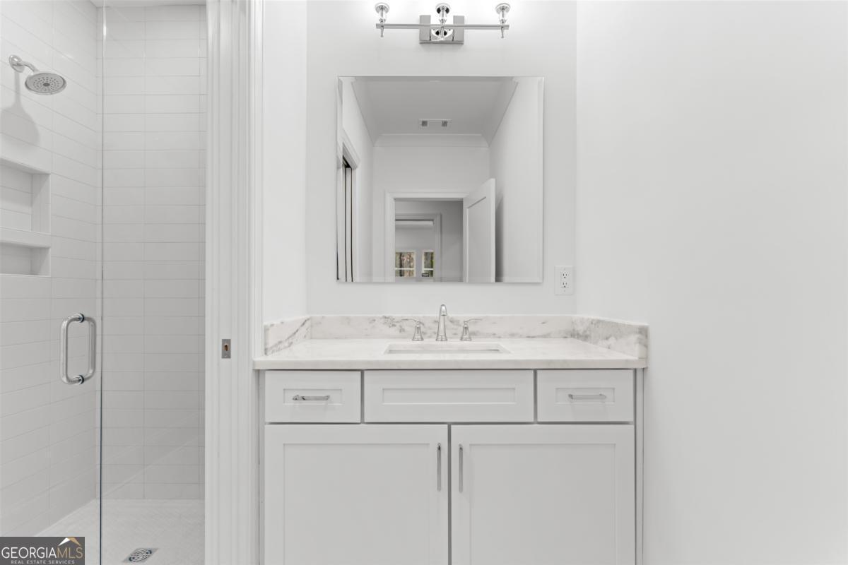 103 Mags Path Eatonton, GA 31024 - Photo 46 of 66 a bathroom with a sink and a mirror