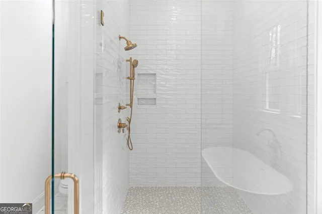 a front view of a house with a garden and yard