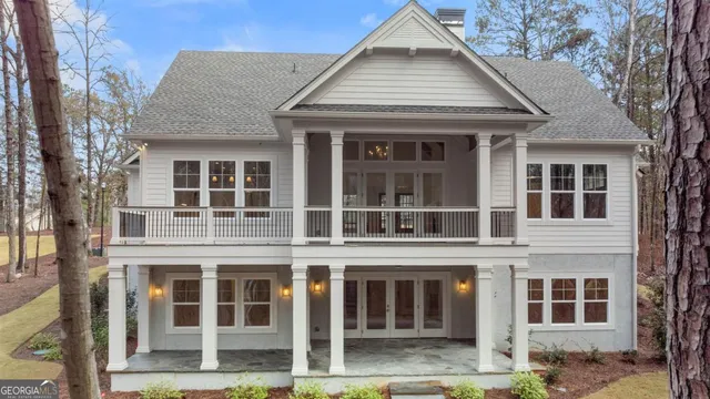 an aerial view of a house with garden space and trees