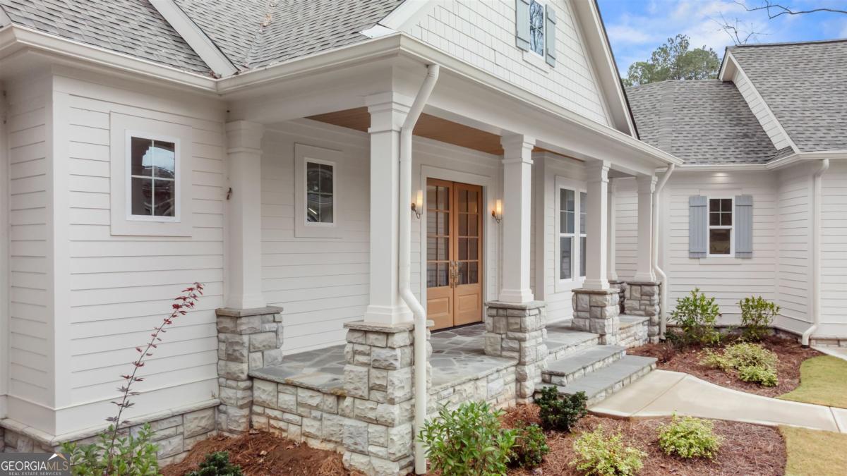 103 Mags Path Eatonton, GA 31024 - Photo 54 of 66 a front view of a house with outdoor seating