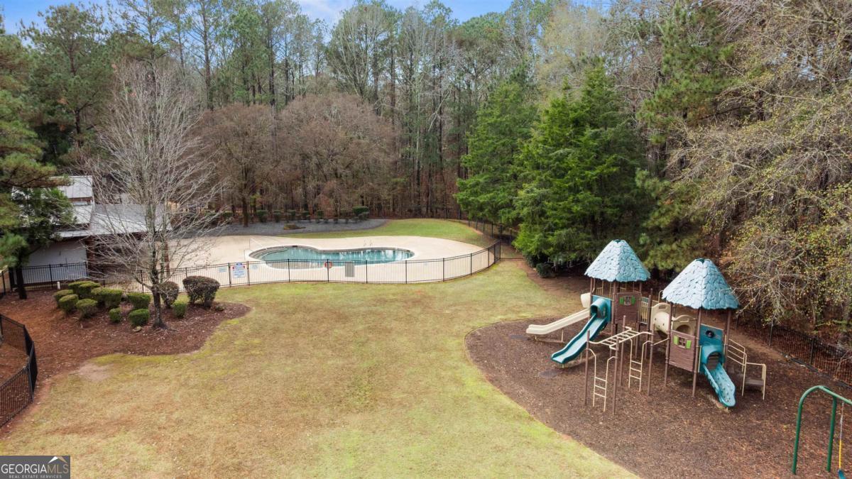 103 Mags Path Eatonton, GA 31024 - Photo 59 of 66 a view of a backyard with plants and a patio