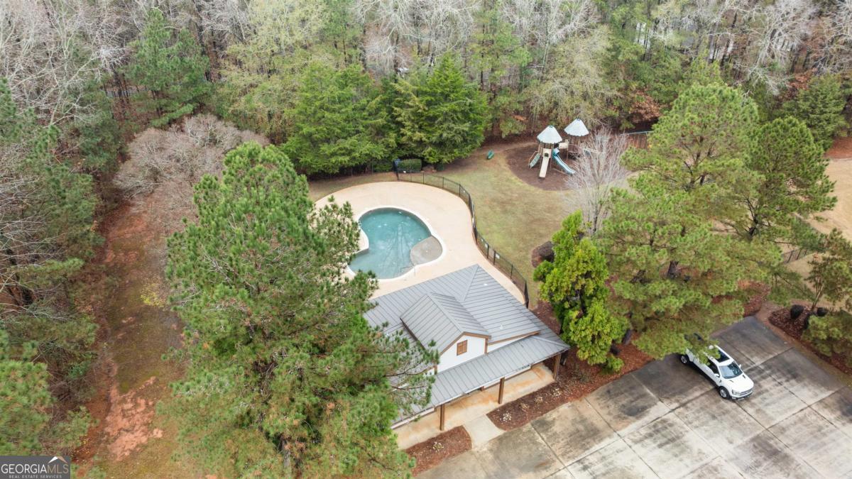 103 Mags Path Eatonton, GA 31024 - Photo 61 of 66 an aerial view of a house with garden space and trees