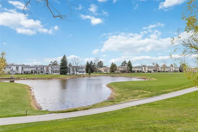 a view of a lake with houses in the back