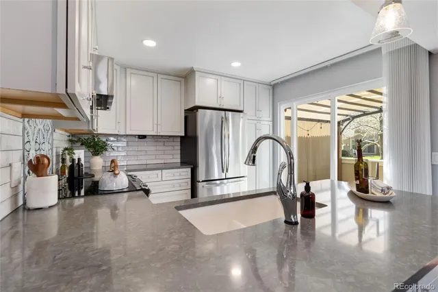a view of kitchen with dining table and chairs