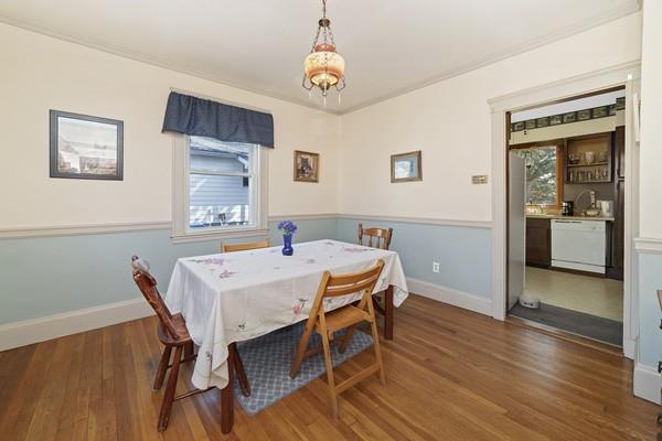 60 Virginia Road Waltham, MA 02453 - Photo 15 of 19 a view of a dining room with furniture and wooden floor