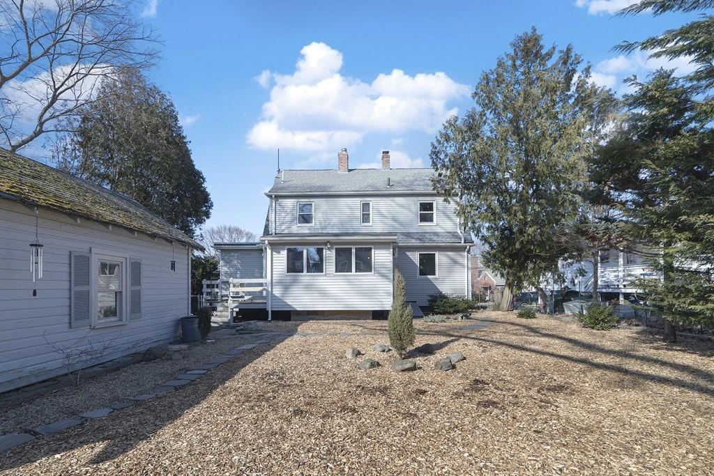 60 Virginia Road Waltham, MA 02453 - Photo 3 of 19 a front view of a house with a yard