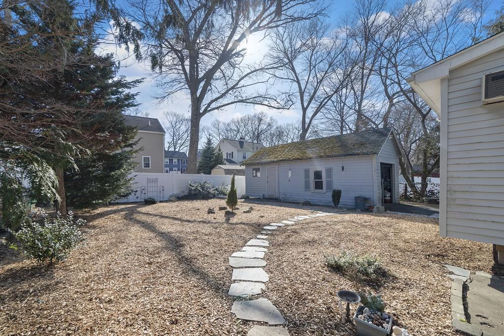 60 Virginia Road Waltham, MA 02453 - Photo 4 of 19 a front view of a house with a yard and garage