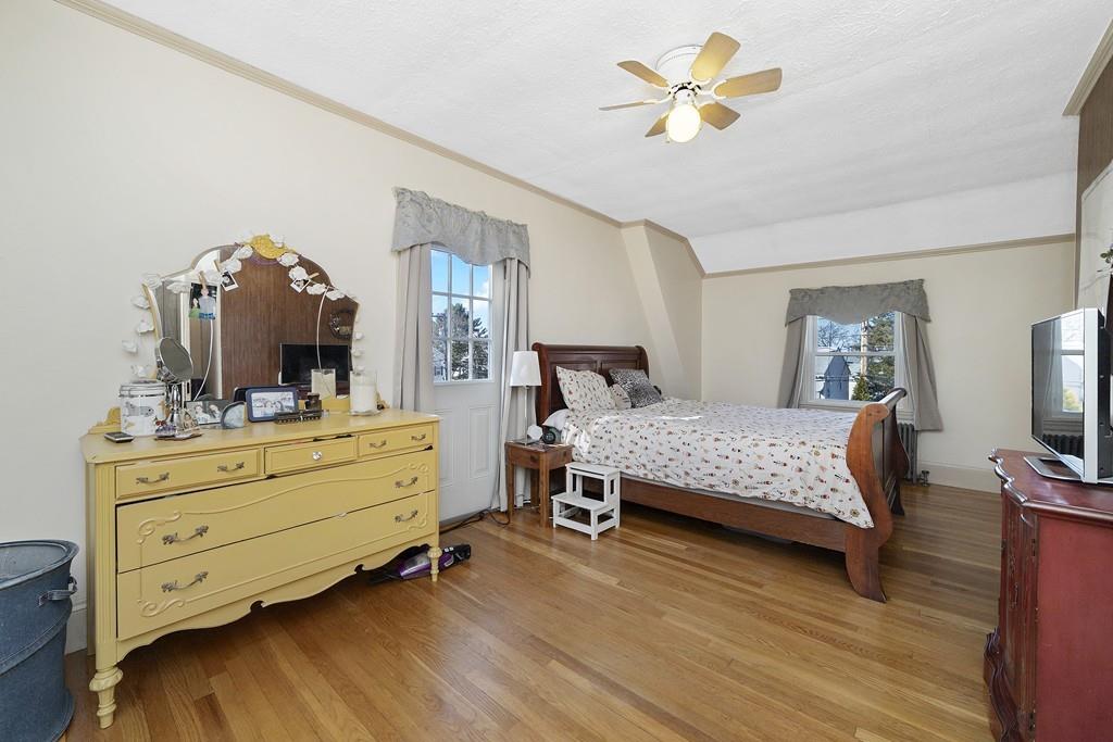 60 Virginia Road Waltham, MA 02453 - Photo 8 of 19 a bedroom with a bed and a dresser