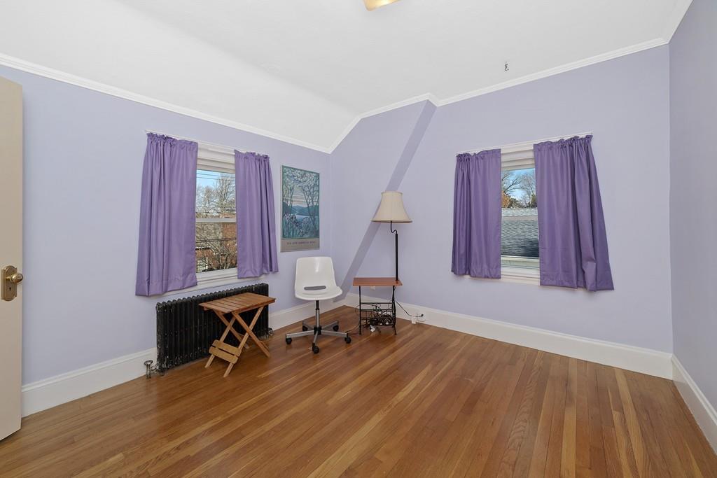 60 Virginia Road Waltham, MA 02453 - Photo 9 of 19 a room with lots of furniture and a wooden floor