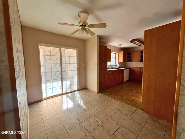a large kitchen with stainless steel appliances granite countertop a stove a sink and a microwave
