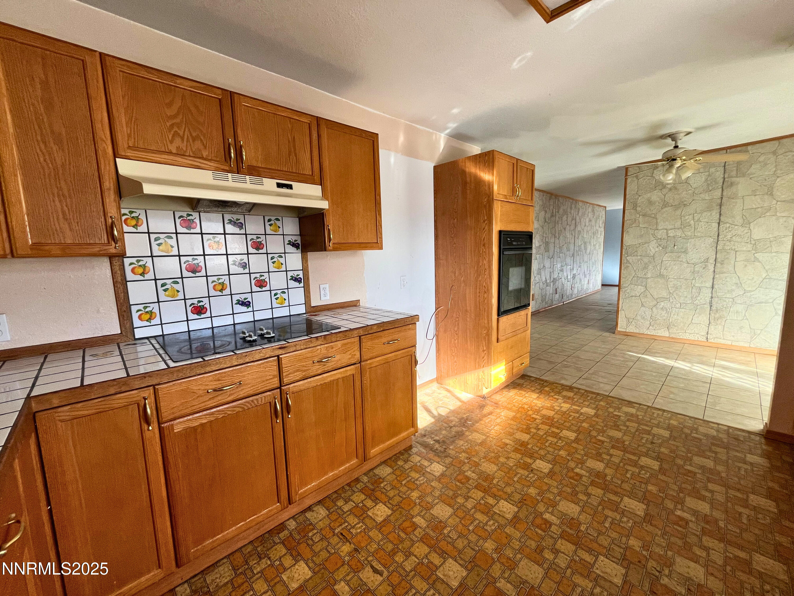 645 K Street Hawthorne, NV 89415 - Photo 6 of 16 a kitchen with stainless steel appliances granite countertop a refrigerator and cabinets