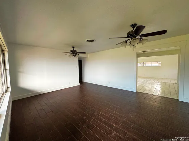 a view of empty room with windows