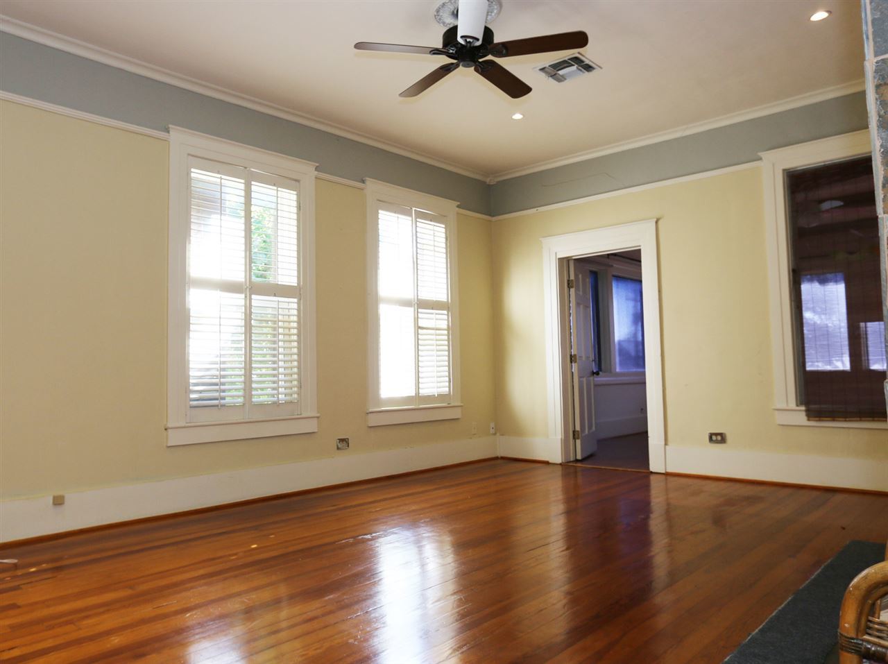 1619 Matamoros Street Laredo, TX 78040 - Photo 13 of 20 a view of an empty room with wooden floor and a window