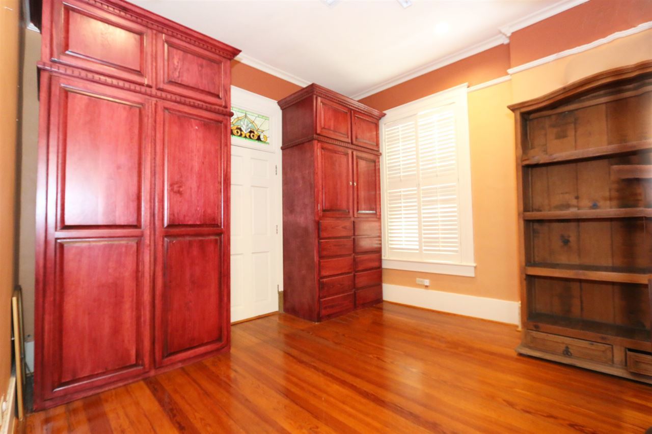 1619 Matamoros Street Laredo, TX 78040 - Photo 15 of 20 an empty room with wooden floor and a window