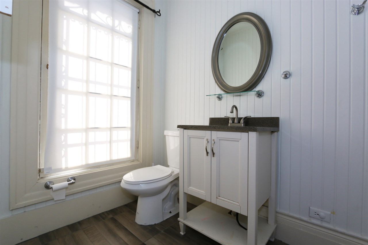 1619 Matamoros Street Laredo, TX 78040 - Photo 16 of 20 a bathroom with a sink a toilet and a window
