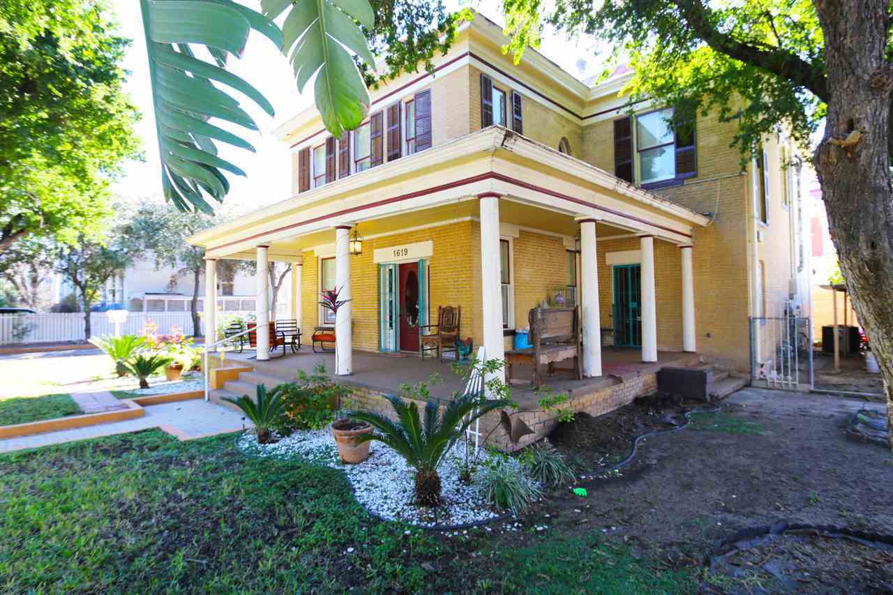 1619 Matamoros Street Laredo, TX 78040 - Photo 20 of 20 a view of a building with potted plants and a large tree